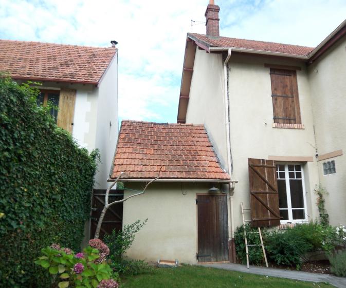 Façades sur jardin avant démolition du garage existant pour la réalisation de l'