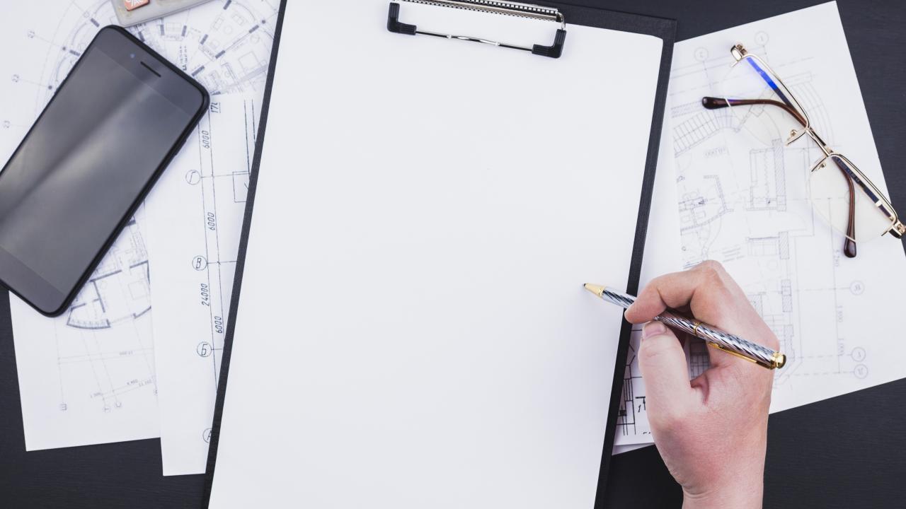 architecture-concept-with-clipboard-hand