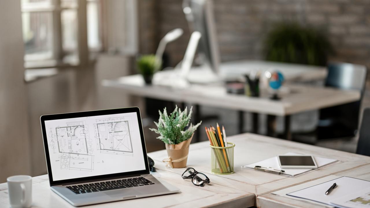 blueprints-computer-monitor-desk-real-estate-office