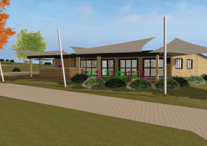 La salle commune, avec son bardage bois, sa terrasse abritée par des voiles d'om