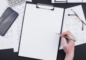 architecture-concept-with-clipboard-hand