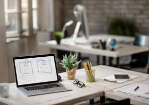blueprints-computer-monitor-desk-real-estate-office